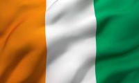 Flag of Ivory Coast blowing in the wind. Full page Ivorian flying flag. 3D illustration.